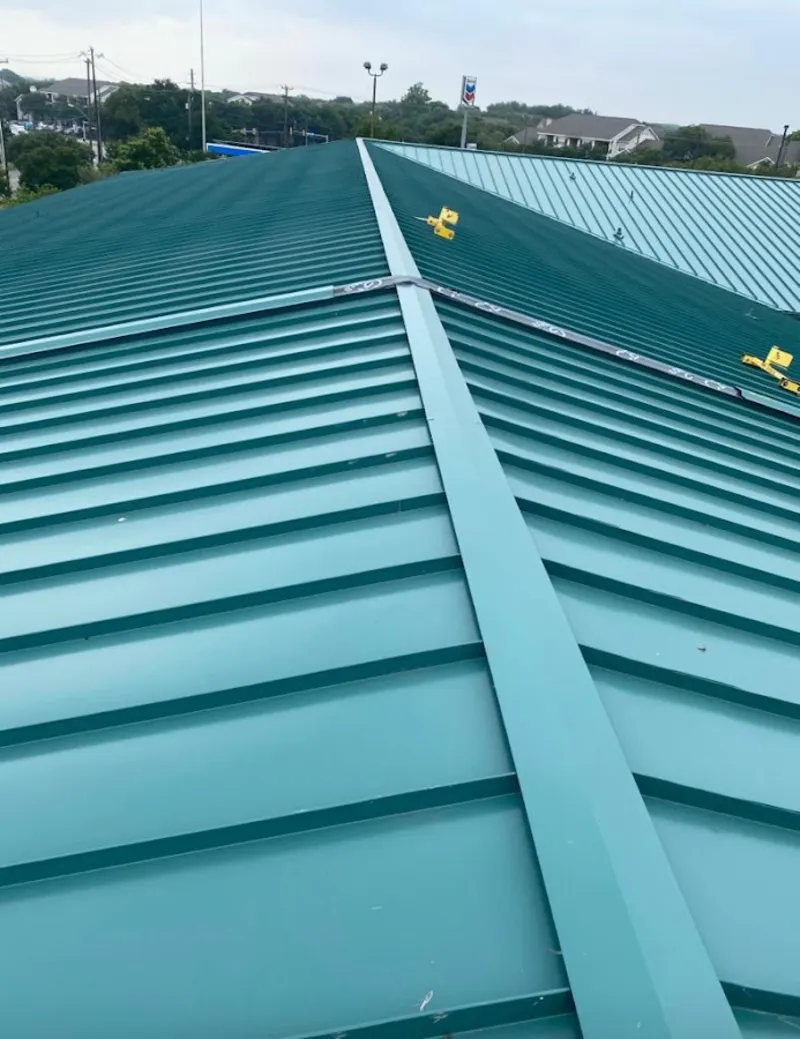 Green commercial metal roof ridge and valley for Metal Roof Repair in El Campo